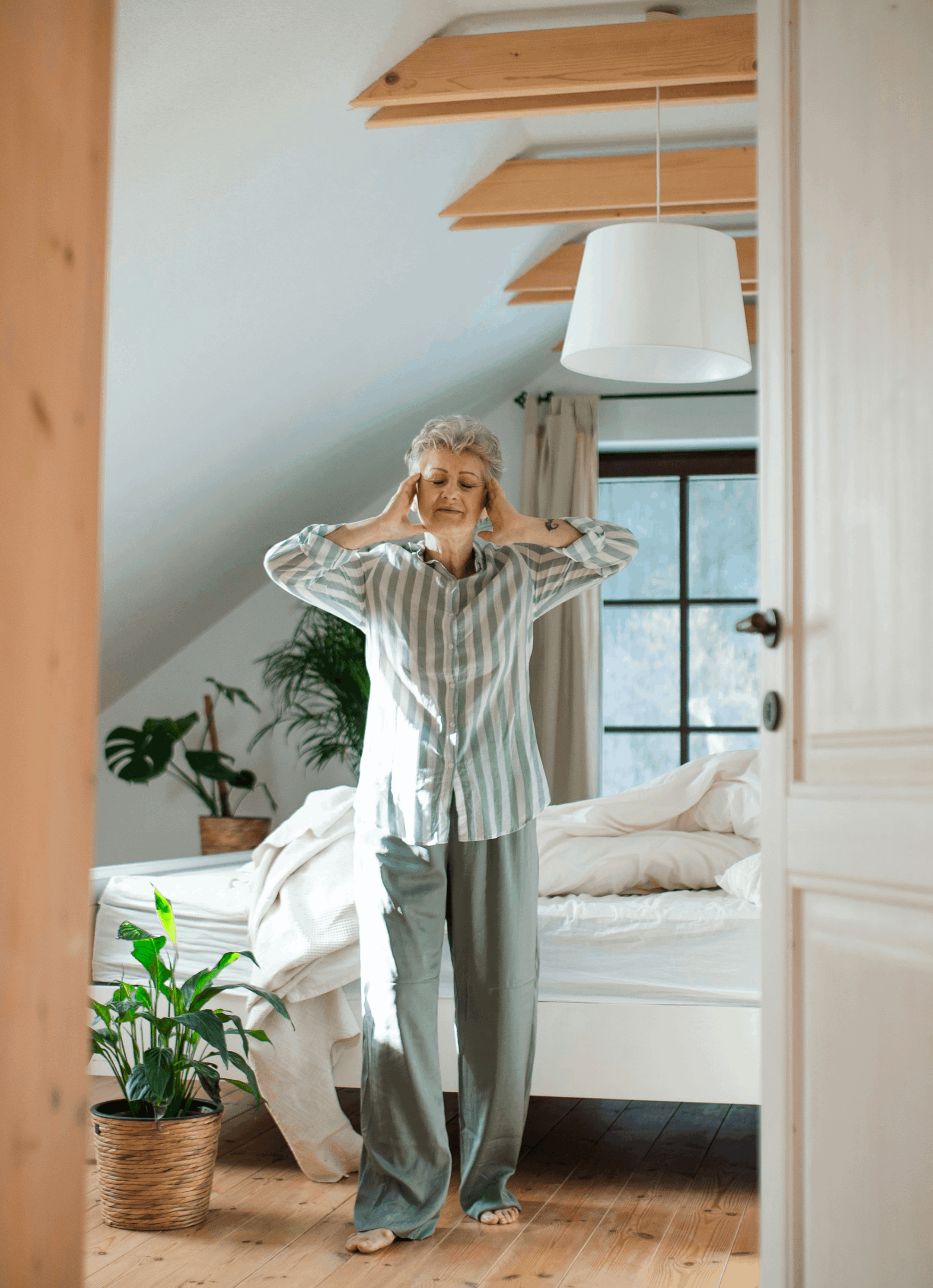 Woman in pijama has a headache